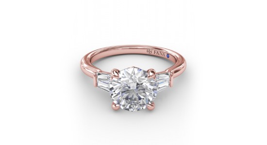 a rose gold, three stone engagement ring featuring a round cut center stone and baguette side stones