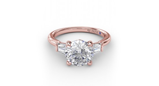 a rose gold, three stone engagement ring featuring a round cut center stone and baguette side stones