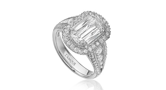 an elaborate diamond white gold engagement ring with a halo and side stones