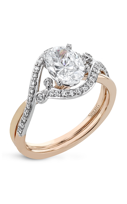 A white and yellow gold engagement ring with oval cut center diamond