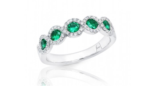 A fashion ring by Fana featuring five vibrant green, halo set emeralds, available at Northeastern Fine Jewelry.