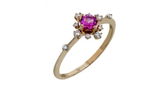 a fashion ring by Simon G. featuring a spinel center stone and diamond accents