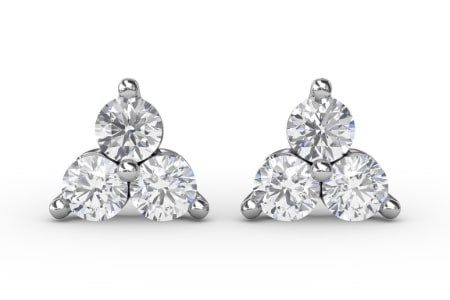 A pair of stud earrings that features a trio of diamonds from Fana.