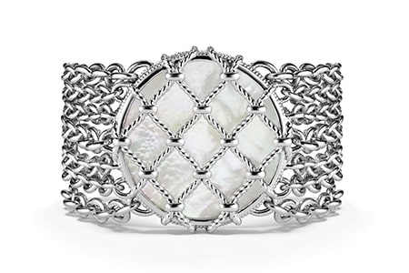 a chunky chain bracelet with a mother of pearl center stone from Judith Ripka.