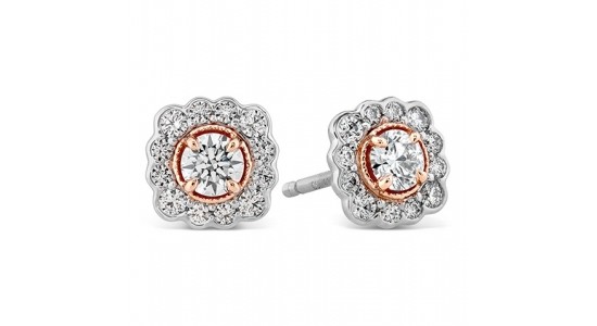 mixed metal diamond halo stud earrings with a floral silhouette