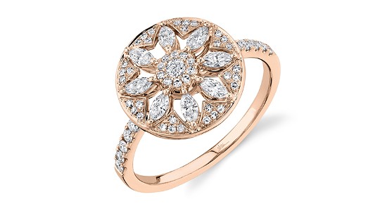 A rose gold cocktail ring with a diamond studded flower shape, available at Northeastern Fine Jewelry.