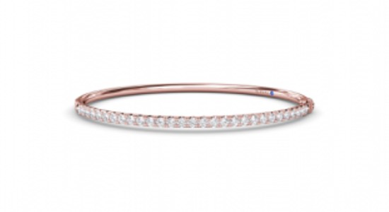 a rose gold bangle bracelet by Fana set with diamonds