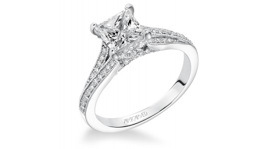 a white gold engagement ring with princess cut center stone