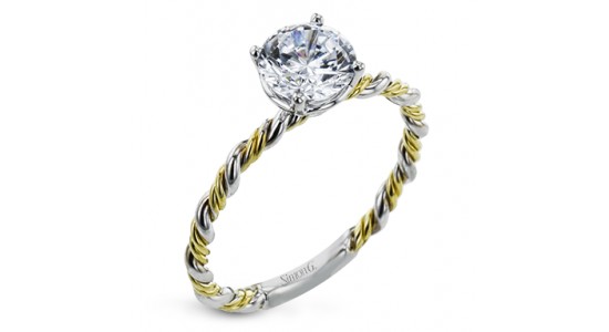 a mixed metal, yellow and white gold, engagement ring with a twisted band and round cut diamond