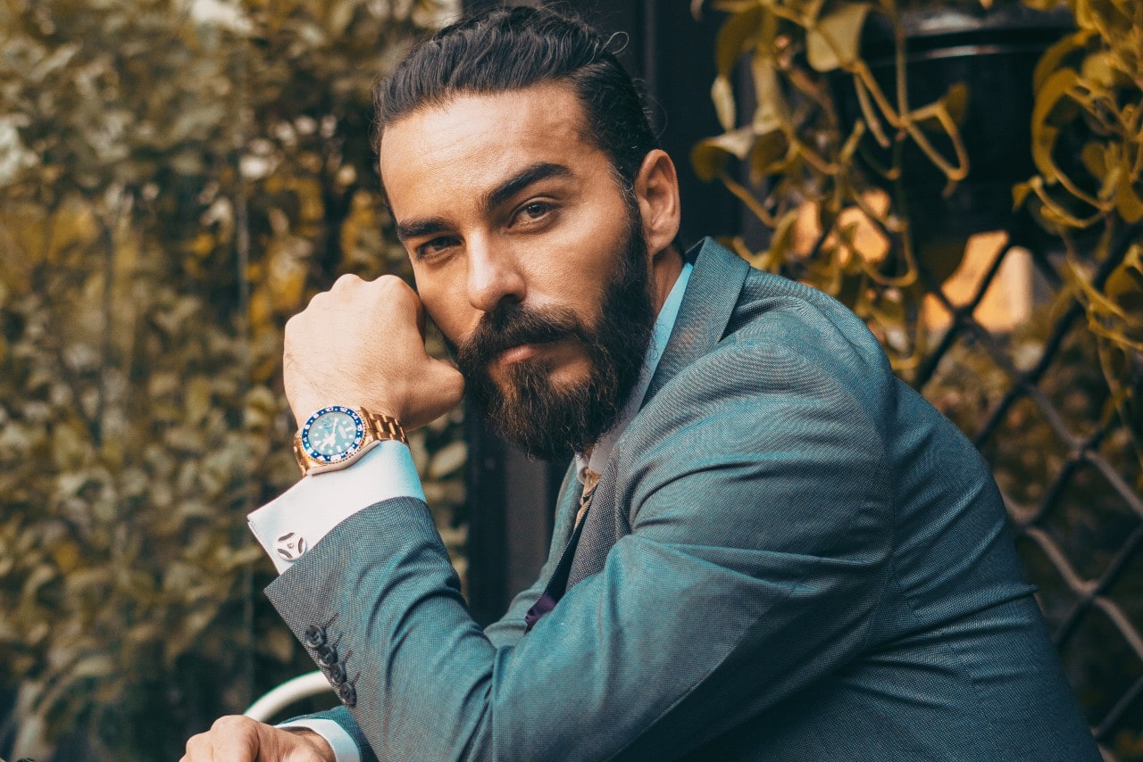 man wearing a suit and a luxury watch