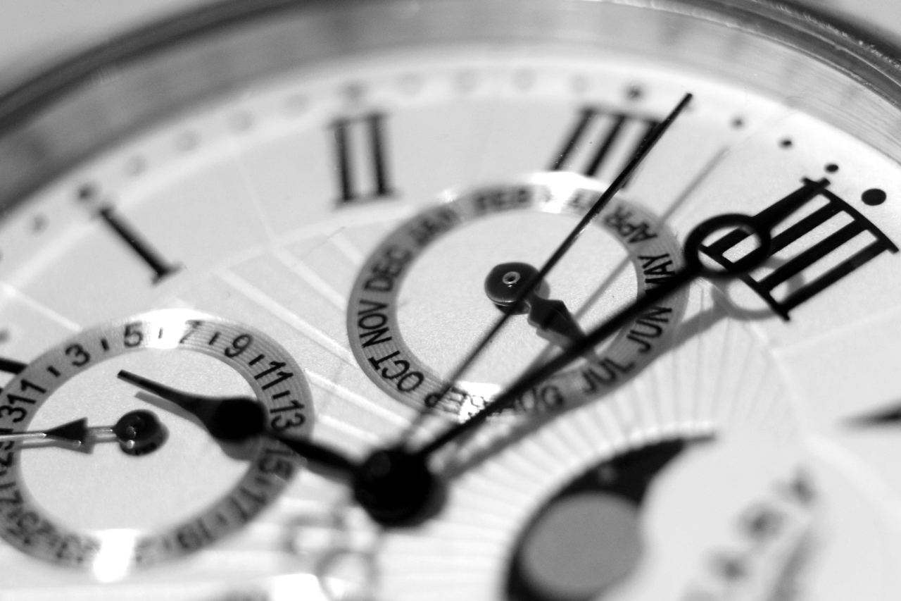 A close-up of the date and moonphase complications on a luxury watch dial.