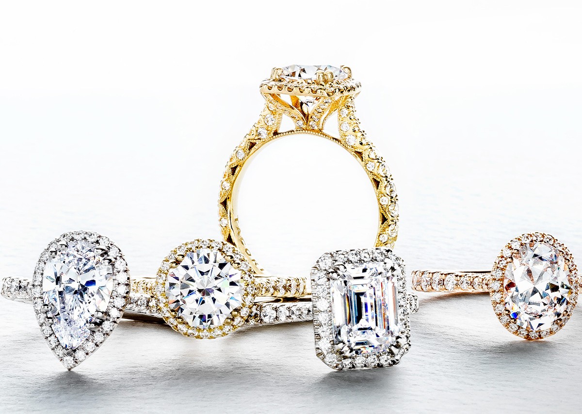 five TACORI engagement rings with different diamond cuts and metal types