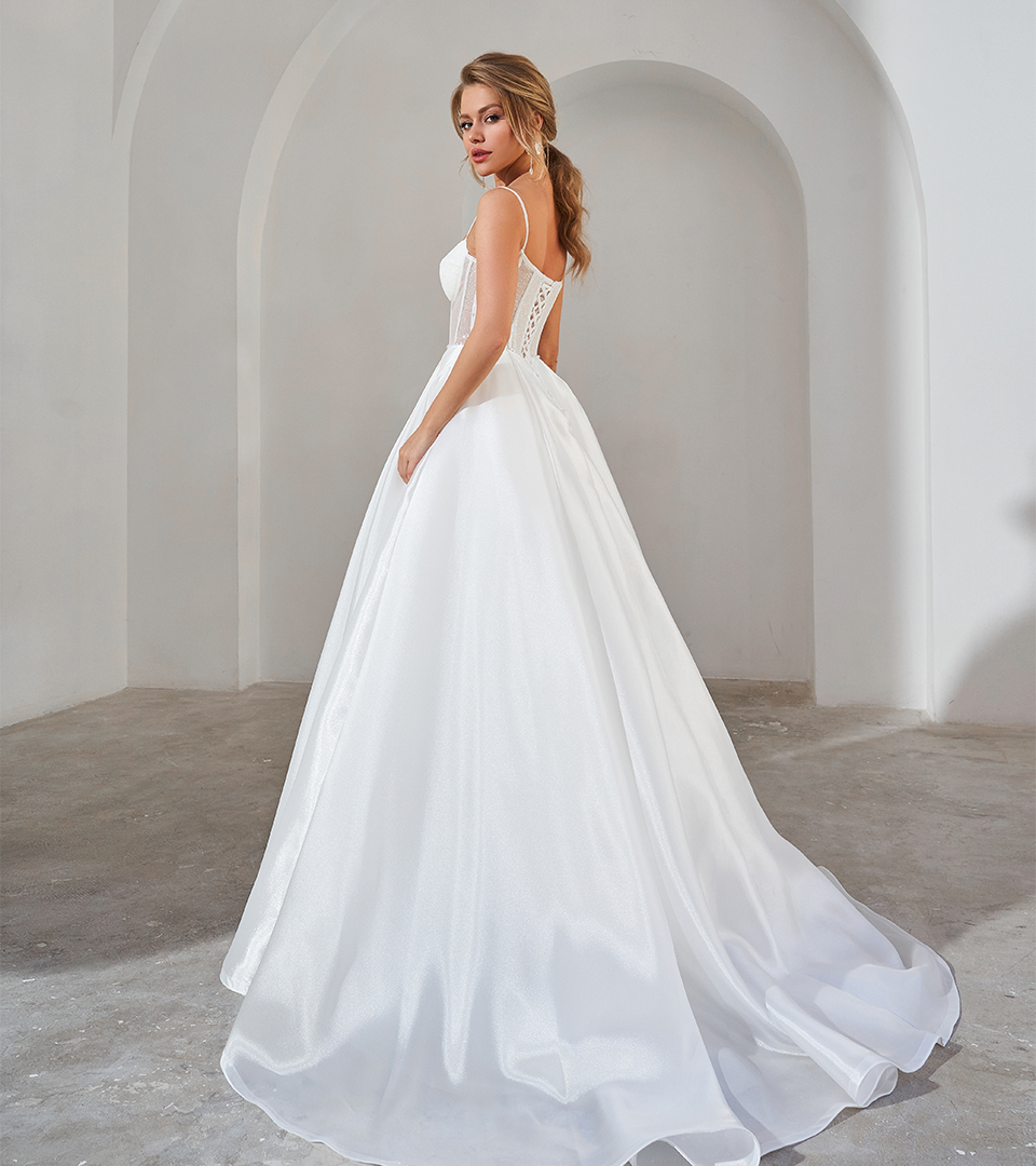 Bride standing in a white wedding dress