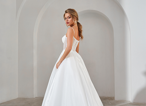 Bride standing in a white wedding dress