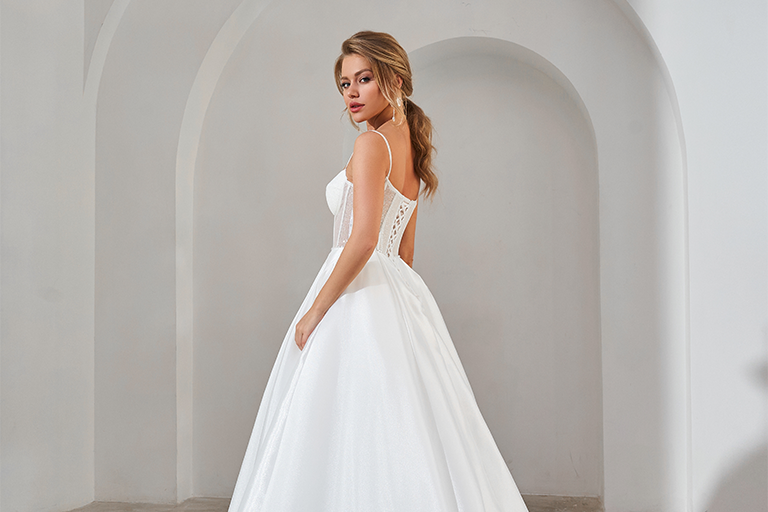 Bride standing in a white wedding dress