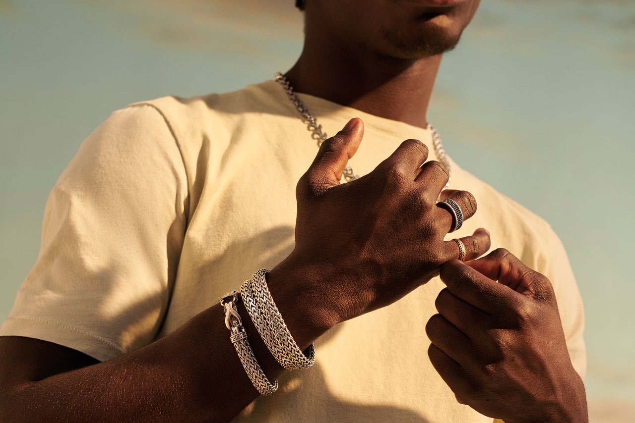 a man wearing fashion jewelry by John Hardy